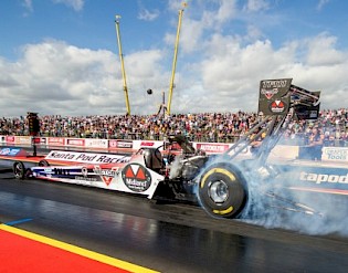 modified car releasing smoke from tire