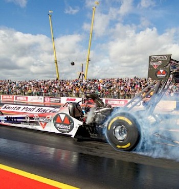 modified car releasing smoke from tire